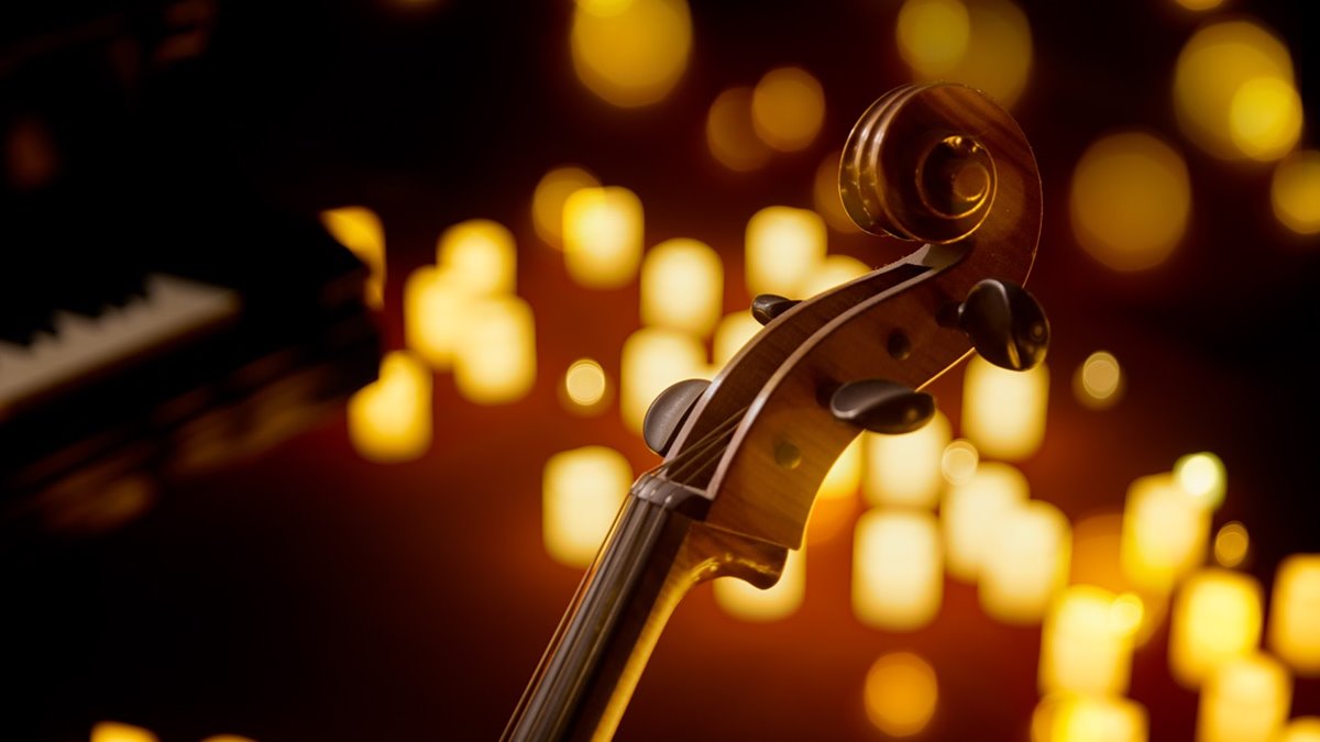 article thumb - A cello surrounded by candles at a Candlelight Concerts Club concert