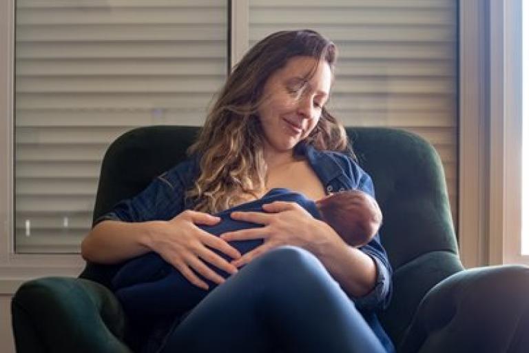 Woman breastfeeding baby