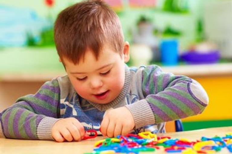Child with special educational needs playing 