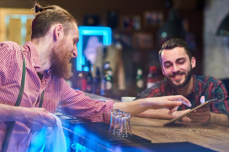 Hospitality worker chatting with customer