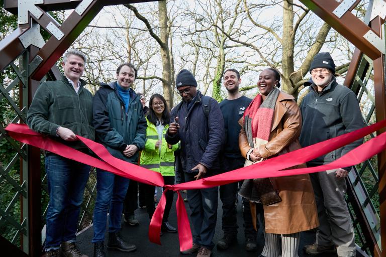 Local people celebrate the reopening of Cox Walk Footbridge