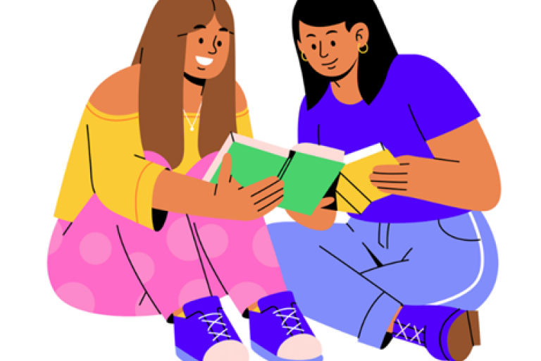 Two women reading a book together