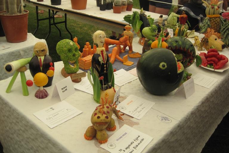 An array of vegetables carved and sculpted to look like people