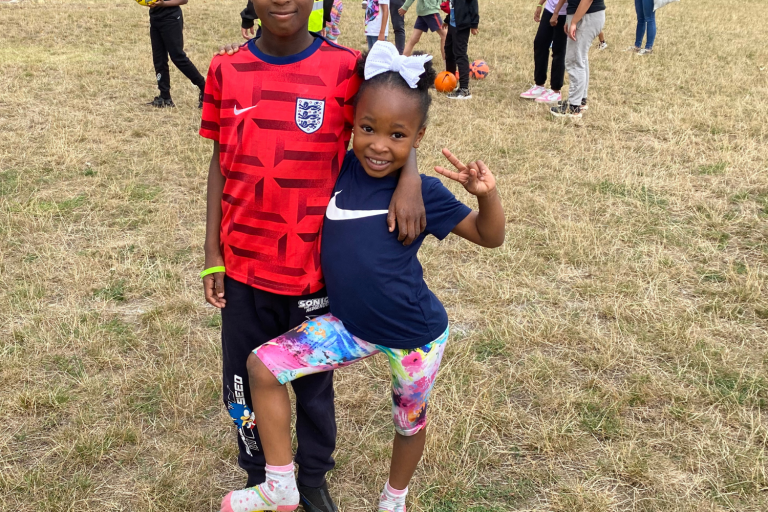 two kids playing football