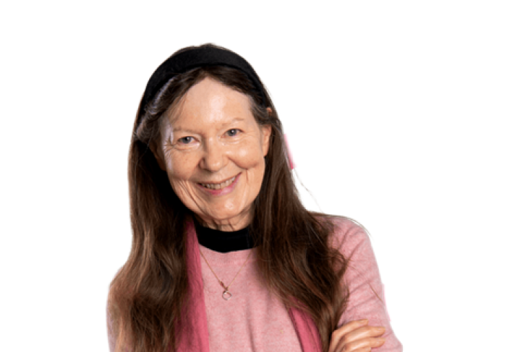 A woman with long brown hair, wearing a pink jumper and long pink scarf
