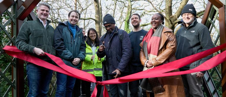Local people celebrate the reopening of Cox Walk Footbridge
