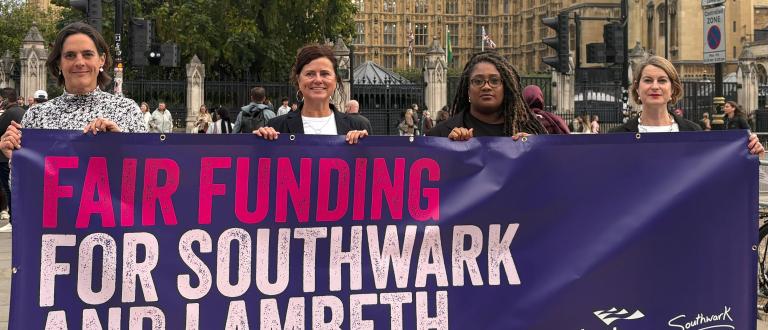 Leaders and MPs carry a fair funding banner