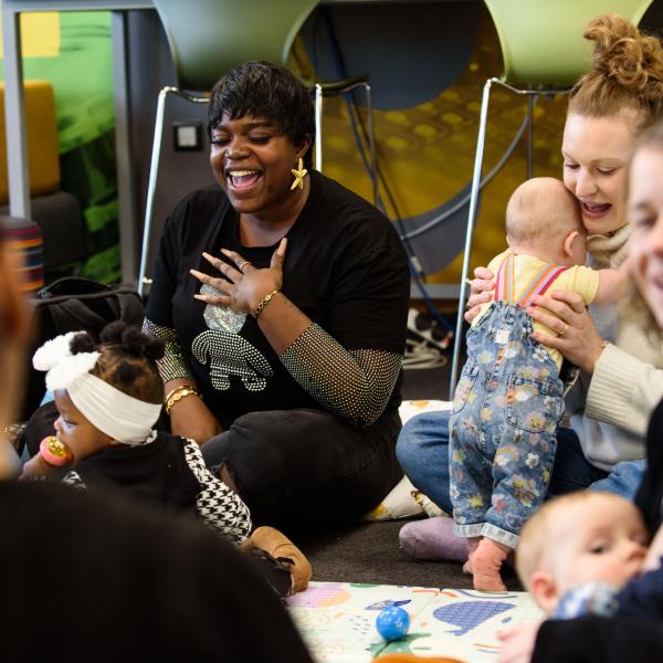 Mum singing with babies