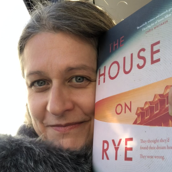 Picture of author Susan Allott with a copy of her book 'The House on Rye Lane'