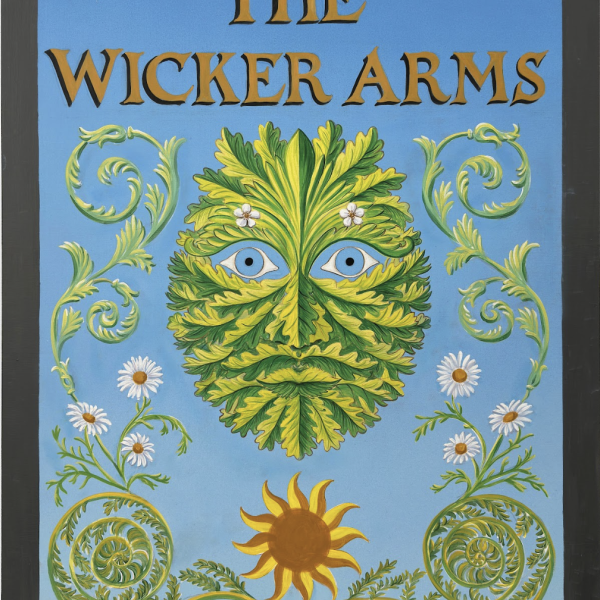A green leafy face on a blue background, surrounded by flowers and the words THE WICKER ARMS