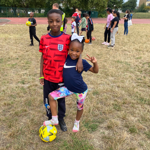 two kids playing football